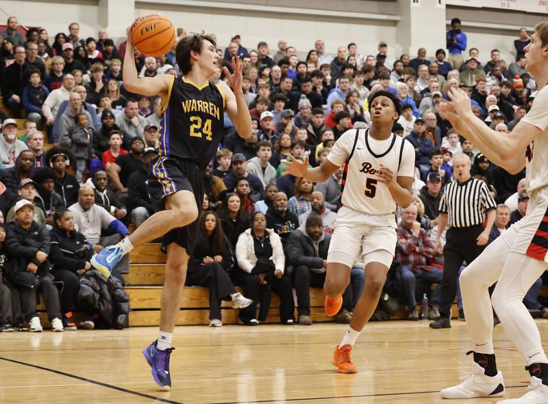 Warren's Joel Paasch (24) tries to save the ball during the When Sides Collide Shootout basketball tournament between Benet Academy and Warren Township high schools on Saturday, Jan. 24, 2026 in Lisle, IL.