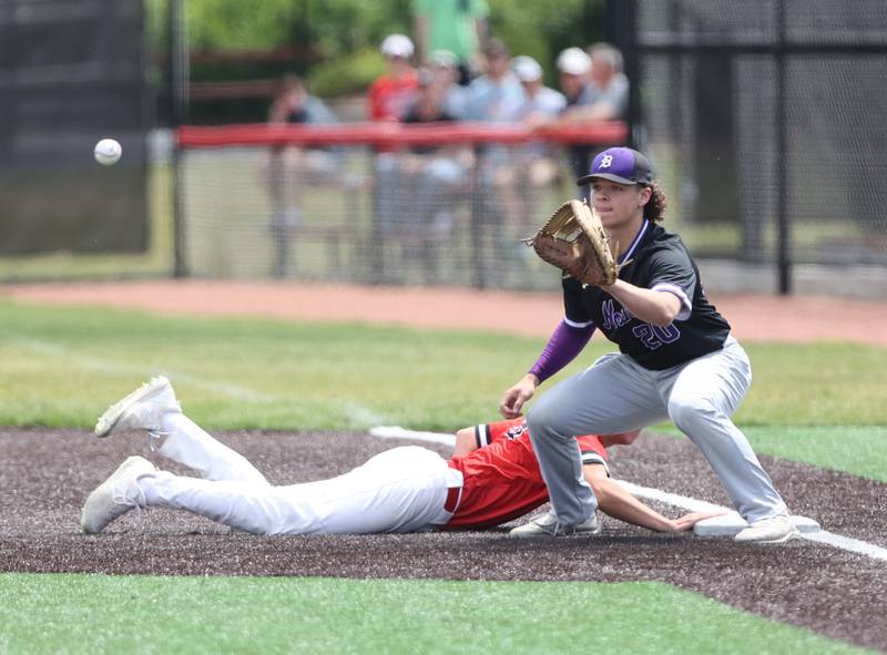 Downers Grove North's Brooks Barofsky (20) tries to get Hinsdale Central's Max Pavlik (26) on a pick-off attempt during the IHSA Class 4A baseball regional final between Downers Grove North and Hinsdale Central at Bolingbrook High School on Saturday, May 27, 2023.