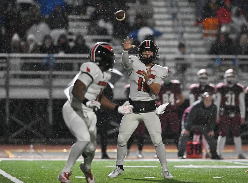 Metamora's Stephen Petri (16) throws a pass intended for  Jaiduan Cranford (1) during the class 4A second round playoff game against Morris on Saturday, NOV. 08, 2025, at Morris.