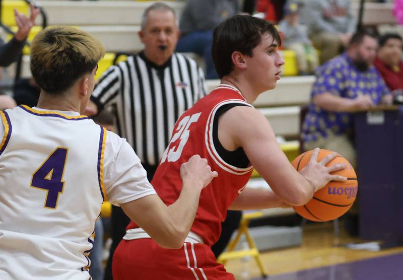 Ottawa's Lucas Farabaugh looks to pass the ball around Mendota's Johan Cortez on Tuesday, Jan. 6, 2026 at Mendota High School.