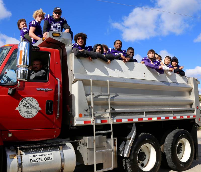 Plano High School Varsity Football players participate in the Plano High School Homecoming Parade on Saturday, Oct. 7, 2023 in Plano.