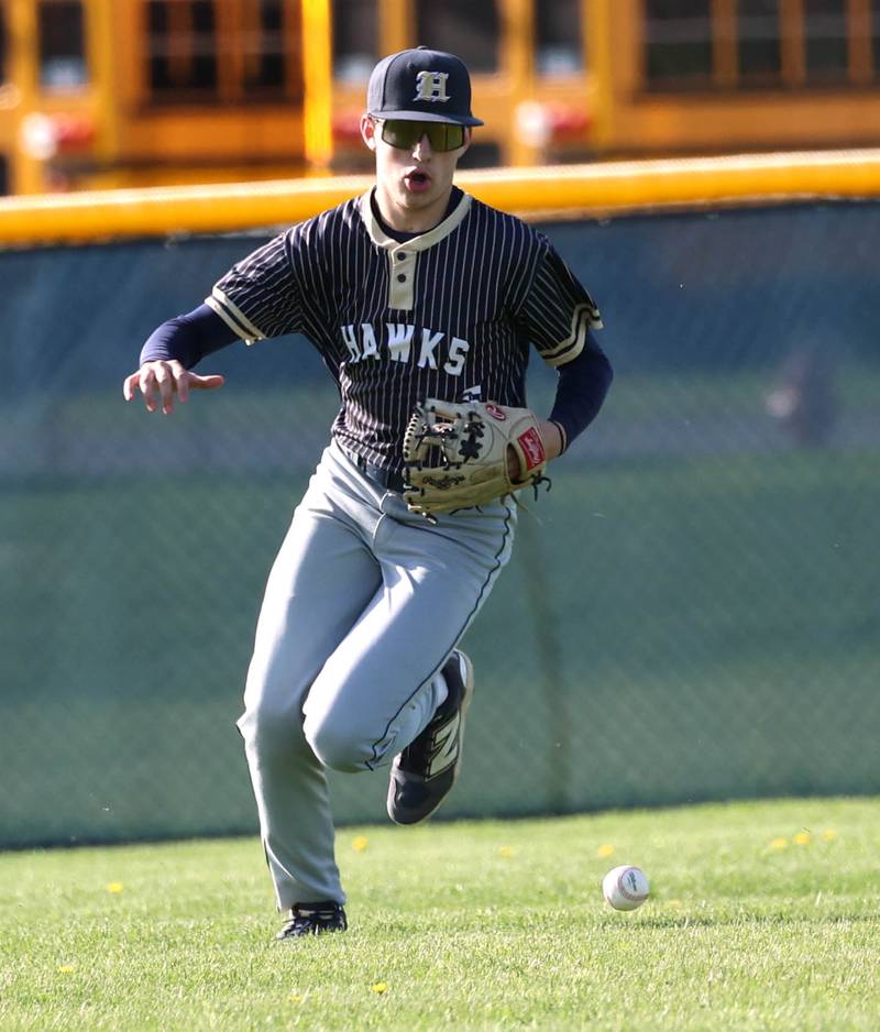 Hiawatha's Colby Wylde charges a ball in left field Tuesday, April 29, 2025, during their game against Hinckley-Big Rock at Hiawatha High School in Kirkland.