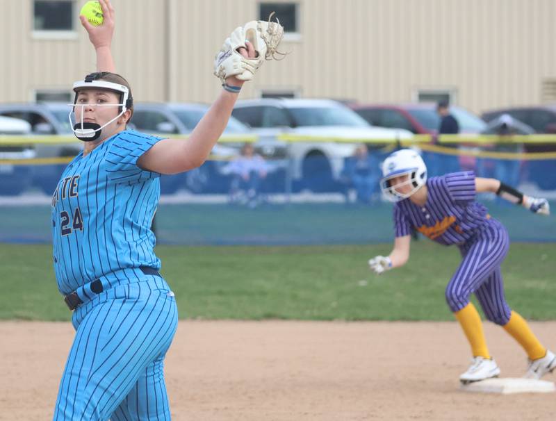 Marquette's Lily Brewer fires a pitch as a Mendota runner prepares to leave second base on Wednesday, March 25, 2026 at June Gross Field in Ottawa.