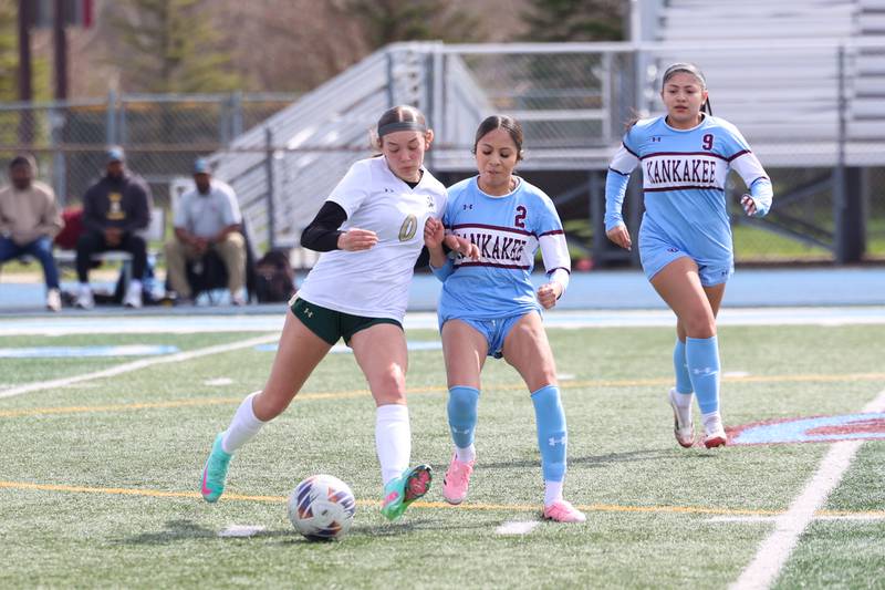 Bishop McNamara's Tatum Smith passes under pressure from Kankakee's Guadalupe Hernandez during the Kays' 8-0 victory in the final All-City match on Saturday, April 11, 2026.