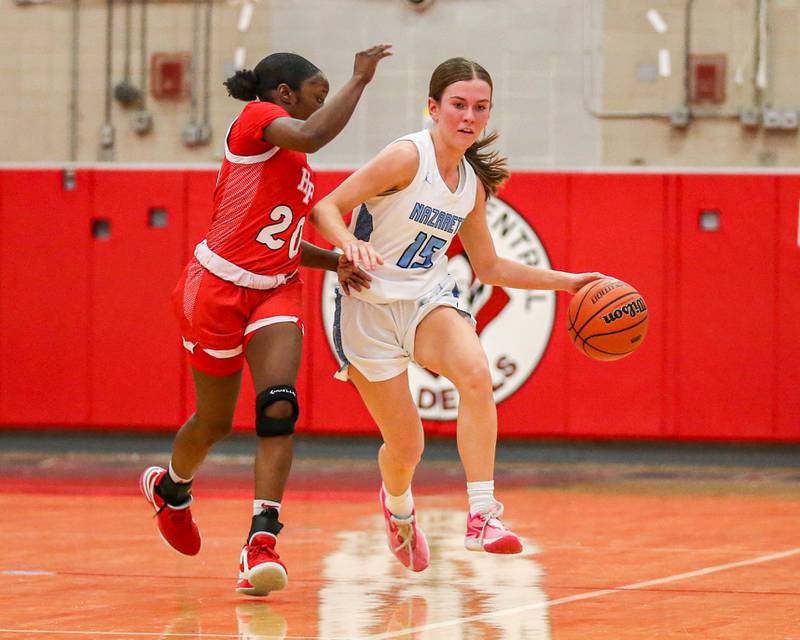 Nazareth's Mary Bridget wilson (15) advances the ball during Class 4A girls supersectional basketball game between Homewood-Flossmoor at Nazareth. Feb