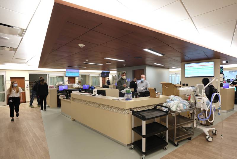 IT workers add the final touches to the "hub and spoke" work station in the emergency room at Northwestern Medicine Kishwaukee Hospital Monday, March 28, 2022, after the completion of the second phase of the three-phase renovation project in the ER at the facility.