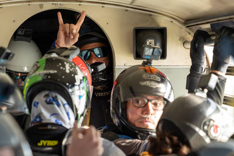 Skydiver gives 2 minute warning to other divers before they attempt to beat the state record of most jumpers in belly formation on Wednesday, Aug 20, 2025 above Skydive Chicago in Ottawa.
