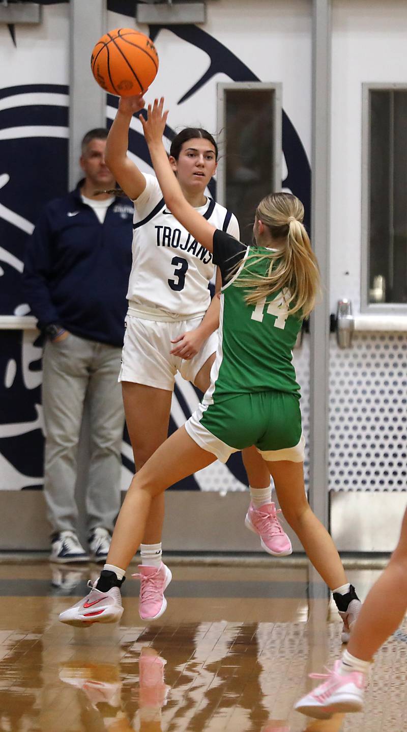 Cary-Grove's Kennedy Manning passes the ball as she is guarded by Crystal Lake South's Makena Cleary during a Fox Valley Conference girls basketball game on Tuesday, Dec. 2, 2025, at Cary-Grove High School in Cary.