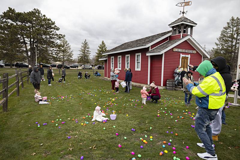 Kids with their loved ones in tow grab and play with eggs Saturday, April 1, 2023, during the Coloma Park District egg hunt at Centennial Park in Rock Falls. For the first time, the district had a hunt for children ages 2 and younger.