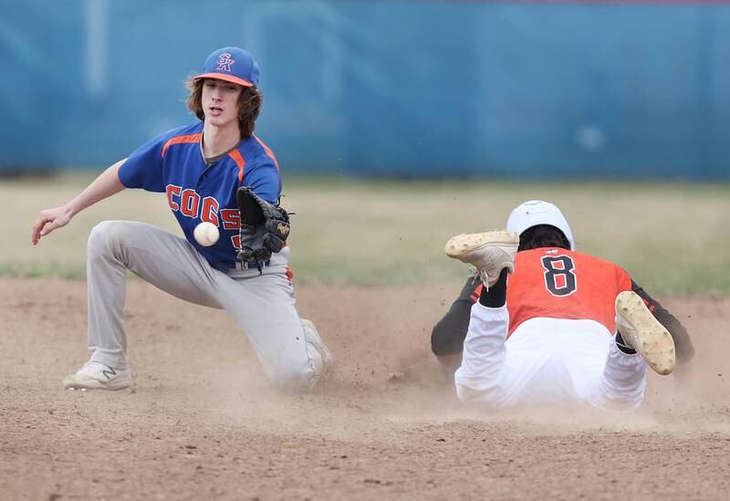Genoa-Kingston's Aidan Awe takes the throw as Winnebago's Alec Weavel slides in with a stolen base during their game Tuesday, April 12, 2022, at Genoa-Kingston High School.