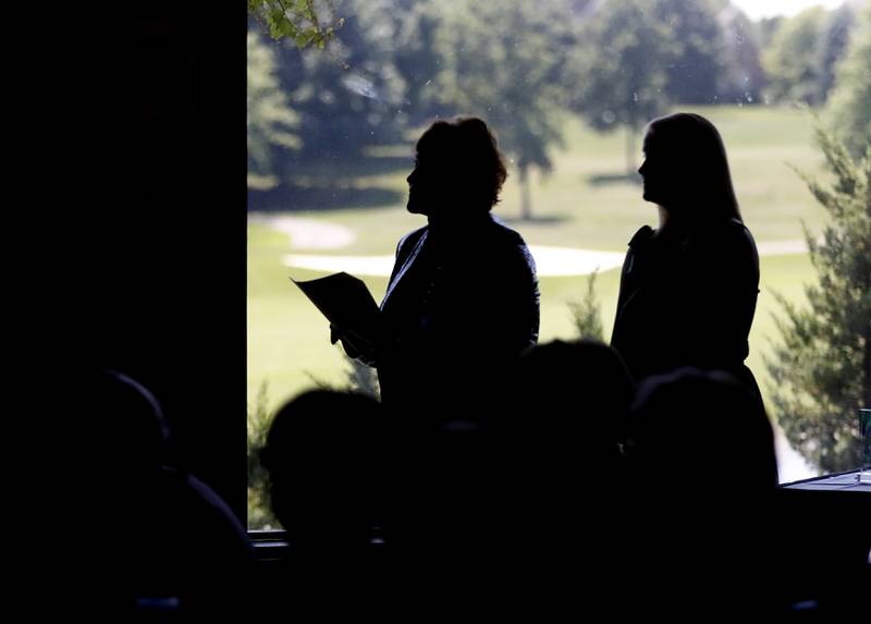 Kathleen Caldwell of Caldwell Consulting Group and Northwest Herald Publisher Laura Shaw listen to an award winner speak during the Northwest Herald's Women of Distinction award luncheon Wednesday June 29, 2022, at Boulder Ridge Country Club, 350 Boulder Drive in Lake in the Hills. The luncheon recognize 10 women in the community as Women of Distinction plus Lisa Hoeppel as the first recipient of the Kelly Buchanan Woman of Inspiration award. This year's Women of Distinction are Catherine Peterson, Cathy Daharsh. Laura King, Kim Ulbrich, Kimberly Dahlem, Laura Evers, Brenda Napholz, Guadalupe Ortiz, Terry Willcockson and Cheryl Wormley.