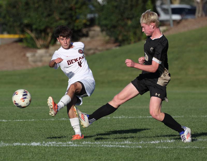 DeKalb's Zachariah Murray kicks the ball away from Sycamore's Paxton Nicol during the El Classicorn rivalry game Tuesday, Oct. 7, 2025, at Sycamore High School.