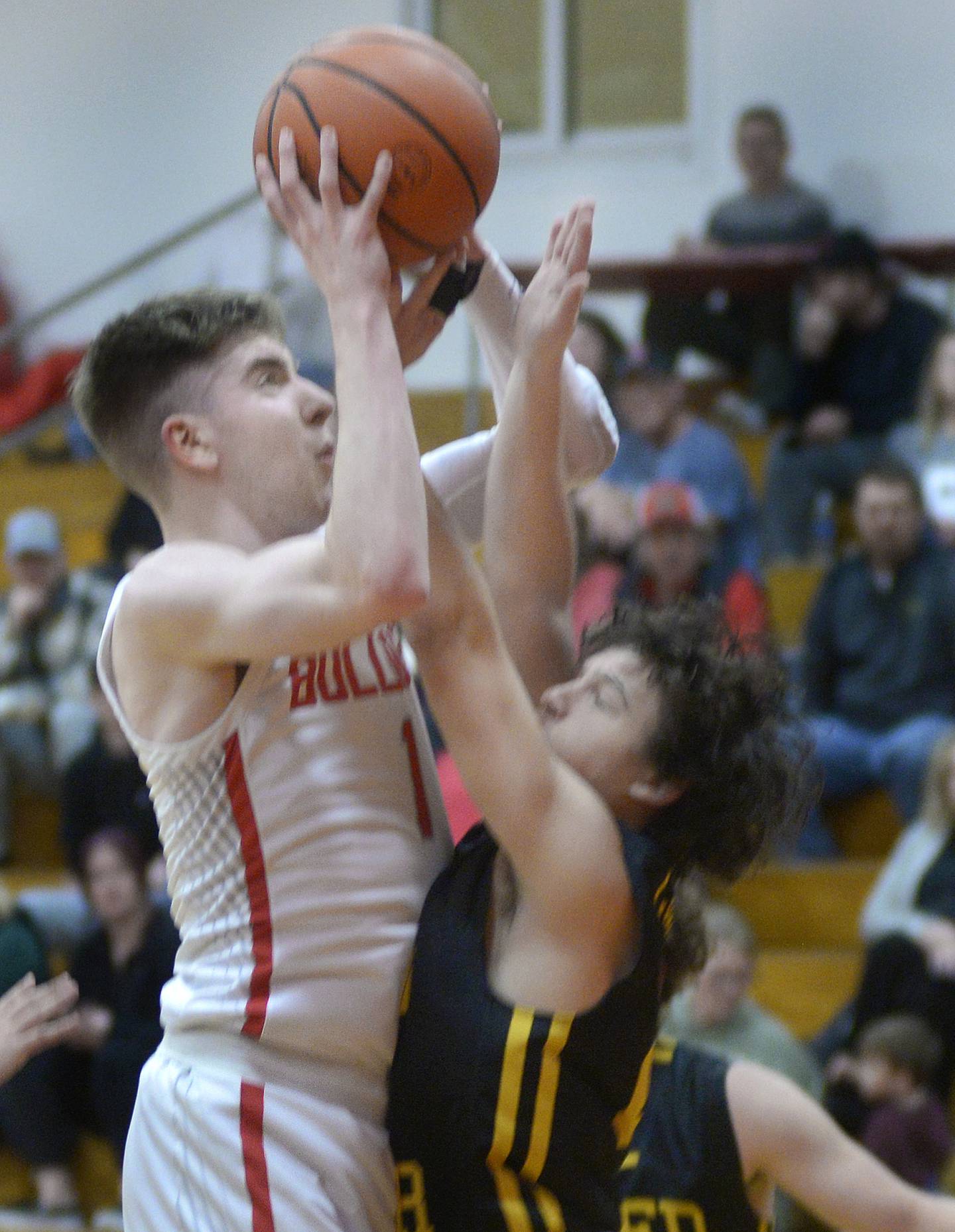 Streator’s Cade Peterson (1) shoots over the block attempt by Reed-Custer’s Brady Tyree on Tuesday, Dec. 5, 2023, at Pops Dale Gymnasium in Streator.