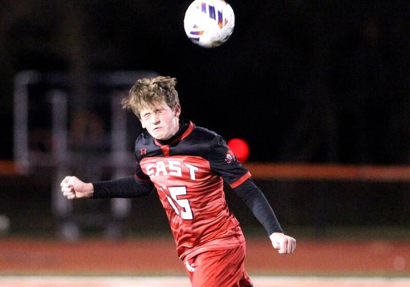 Glenbard East’s Jonny Weltin heads the ball during a 3A St. Charles East Sectional semifinal game against Conant on Wednesday, Oct. 26, 2022.