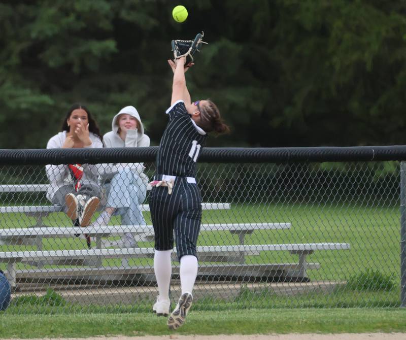 Woodland's Bristol Flowers makes a running catch in foul territory on Tuesday, May 12, 2026 at Woodland High School.