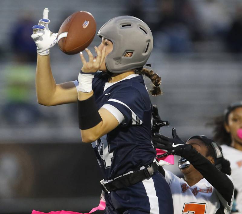 Cary-Grove's Aria Stanton catches a pass during an IHSA McHenry Sectional semifinal girls flag football game against Harlem on Monday, Oct. 13, 2025, at McCracken Field in McHenry.