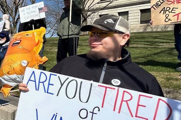 Signs, singing, support showcased at Dixon’s No Kings protest