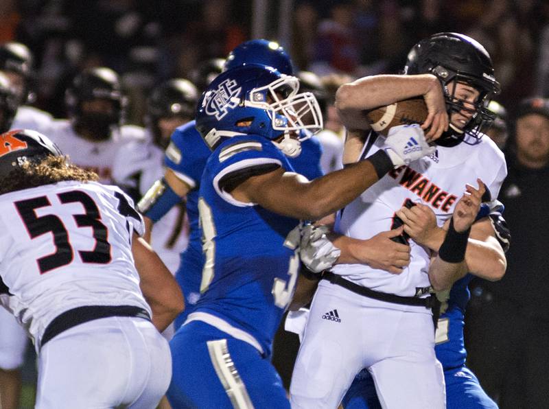 Kewanee QB Will Bruno is sacked by Newman's Marcus Williams Friday Oct. 22, 2021.