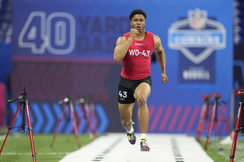 Cincinnati wide receiver Tyler Scott runs the 40-yard dash during the NFL combine, Saturday, March 4, 2023, in Indianapolis.