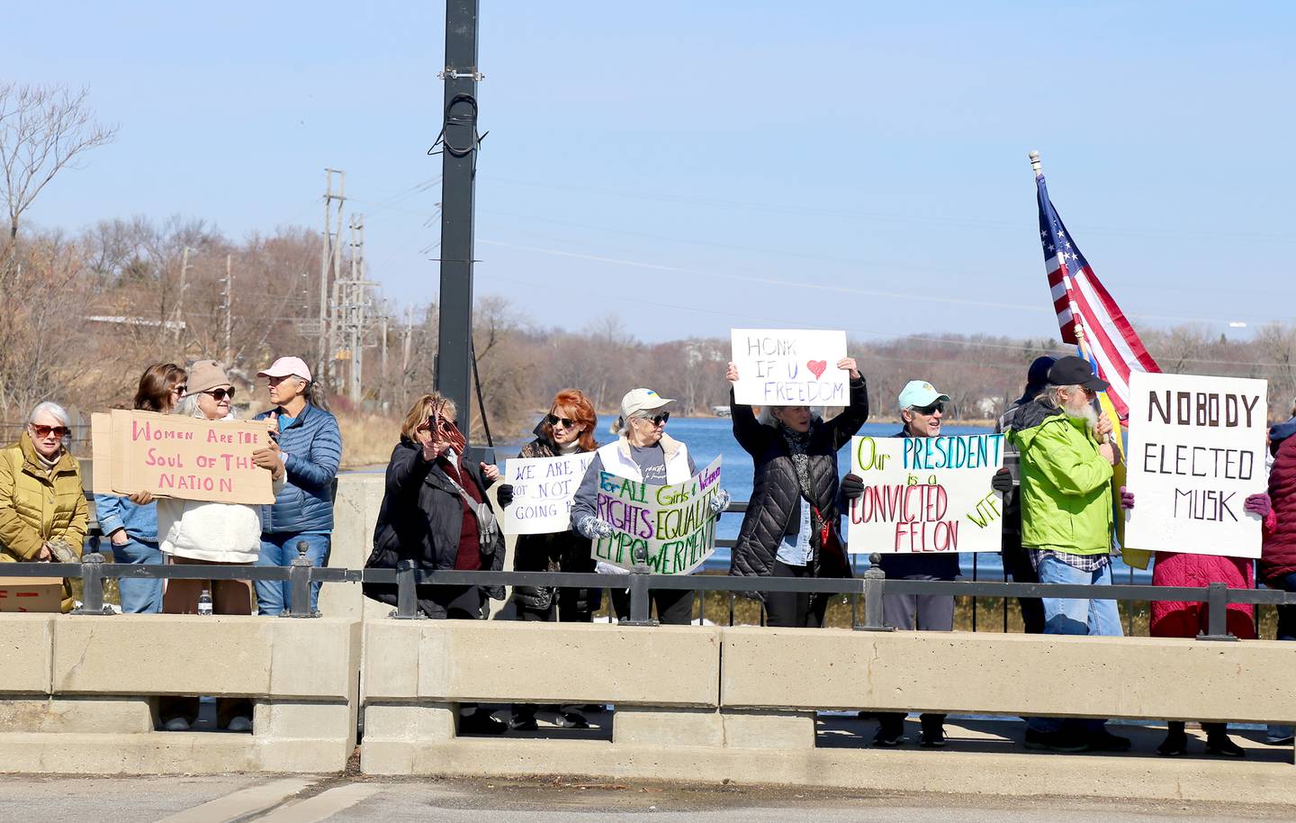 Hundreds of people – mostly women – filled the walkways across the Fox River on Illinois Route 38 in Geneva, spilling over to the sidewalks on either side on Saturday, March 8, 2025 in honor of International Women’s Day.