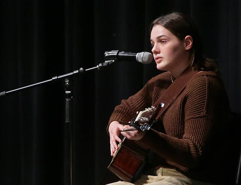 Ottawa Township High School freshman Evvie Jeppson performs while singing a solo during the 48th annual Fine Arts Festival on Thursday, March 17, 2022 at Ottawa High School.