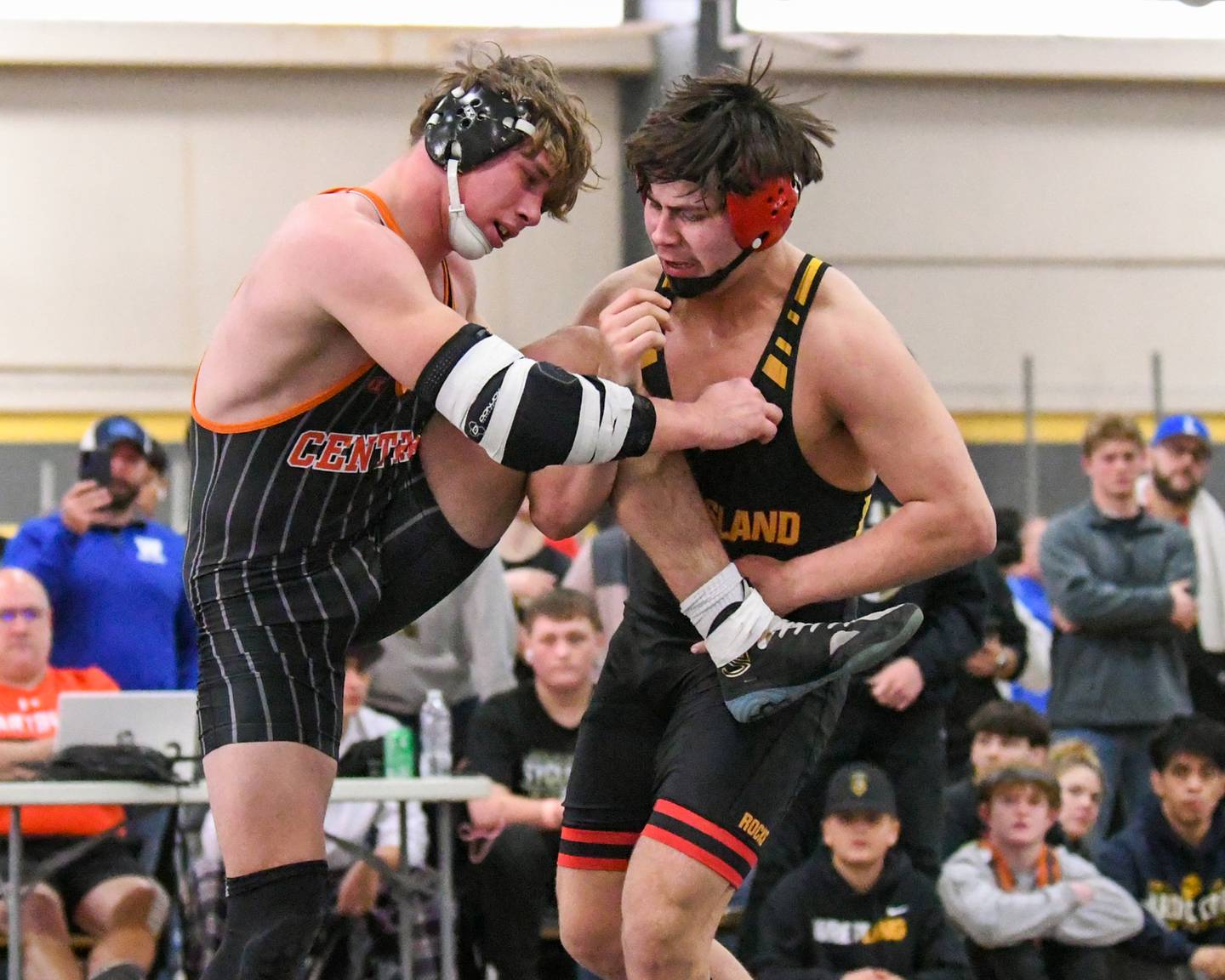 Rock Island wrestler Andre Marquez, right, gets a leg up against Crystal Lake Central Cayden Parks in the 190 weight class during the 2A sectional meet on Saturday Feb. 10, 2024, held at Sycamore High School.