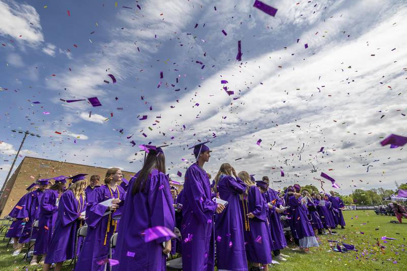 Confetti goes skyward as the Dixon Class of 2025 is announced Sunday, May 25, 2025, during Dixon High School’s graduation.
