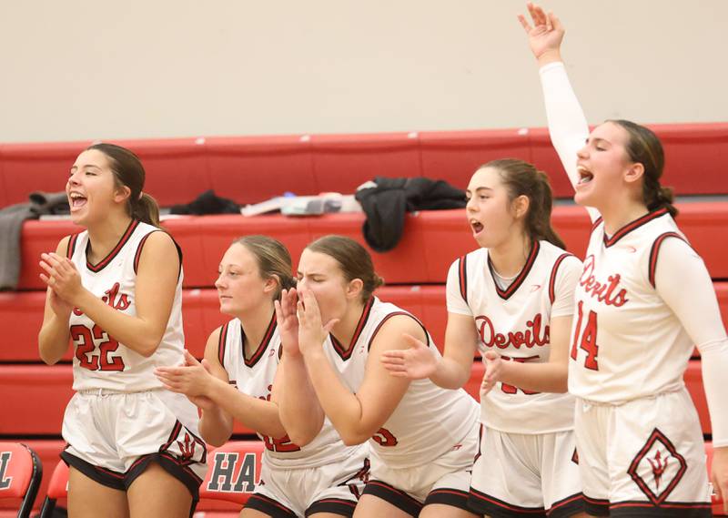 Hall players react after teammate Charlie Pellegrini sinks a three point basket against Mendota on Monday, Dec. 1, 2025 at Hall High School.
