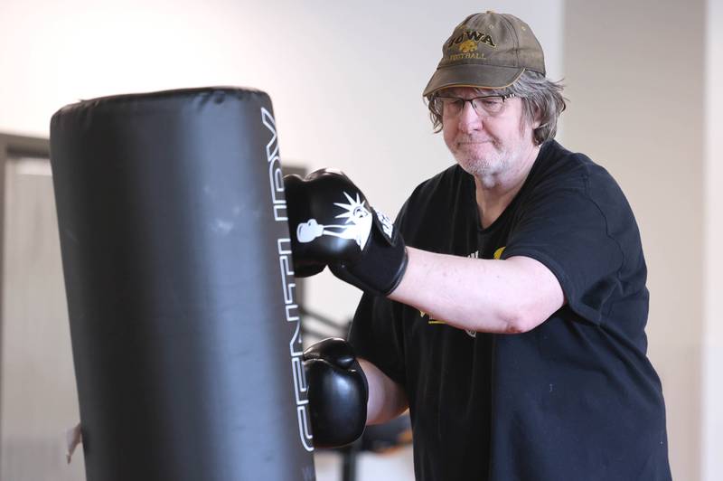 Loren Foelske hits the bag Friday, April 28, 2023, during Rock Steady Boxing for Parkinson's Disease class at Northwestern Medicine Kishwaukee Health & Wellness Center in DeKalb. The class helps people with Parkinson’s Disease maintain their strength, agility and balance.