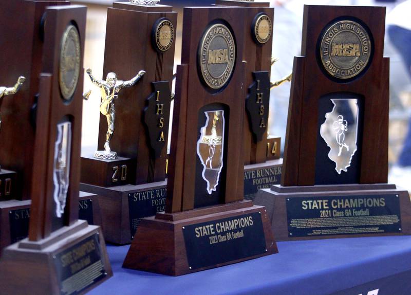 Hardware from Cary-Grove’s historic state tournament appearances were on display during a celebration of the 2023 IHSA Class 6A Champion Cary-Grove football team at the high school Sunday.