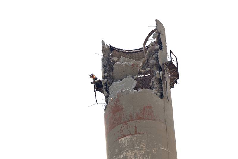 After a couple days of work, only a small area of the stack has been demolished as seen Tuesday, July 22, 2025.
