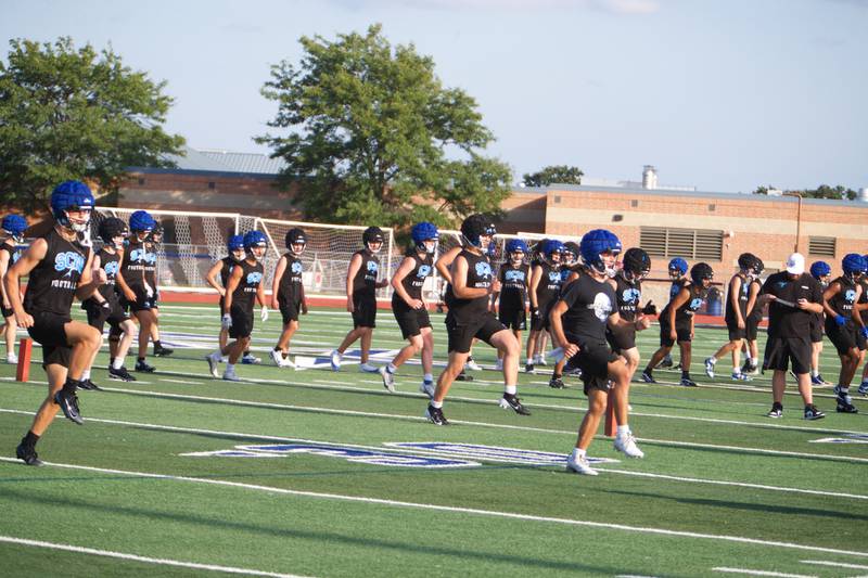 St. Charles North stretch at the first practice on Monday, Aug.11,2025 in St. Charles.