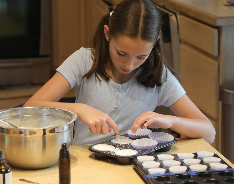 Tenlee Pedersen with some of the bath bombs she makes to sell on Thursday, July 31, 205, and her home near Union. She is one of several young entrepreneurs who will be taking part in a junior market will launch for the first time at the Huntley Farmers Market.