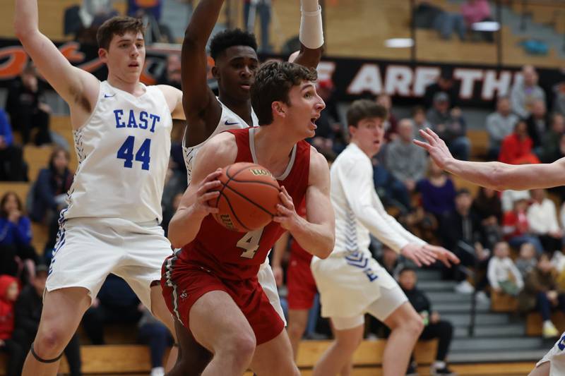 Hinsdale Central’s Chase Collignon looks to pass out of pressure against Lincoln-Way East in the Lincoln-Way West Warrior Showdown on Saturday January 28th, 2023.
