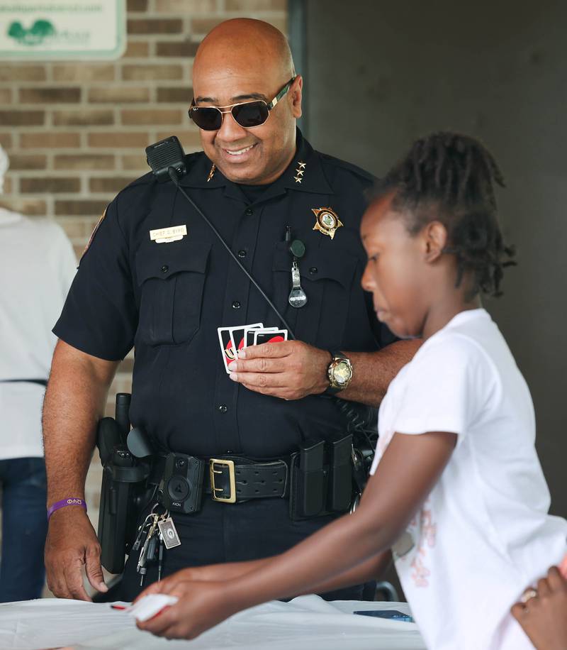 DeKalb Police Chief David Byrd plays Uno with some kids during Fun Jam in the Park Tuesday, June 27, 2023, at Welsh Park in DeKalb. Fun Jam in the Park offers constructive activities for kids on Tuesday and Thursday through August 8th from 5-7 p.m. at various parks in DeKalb.