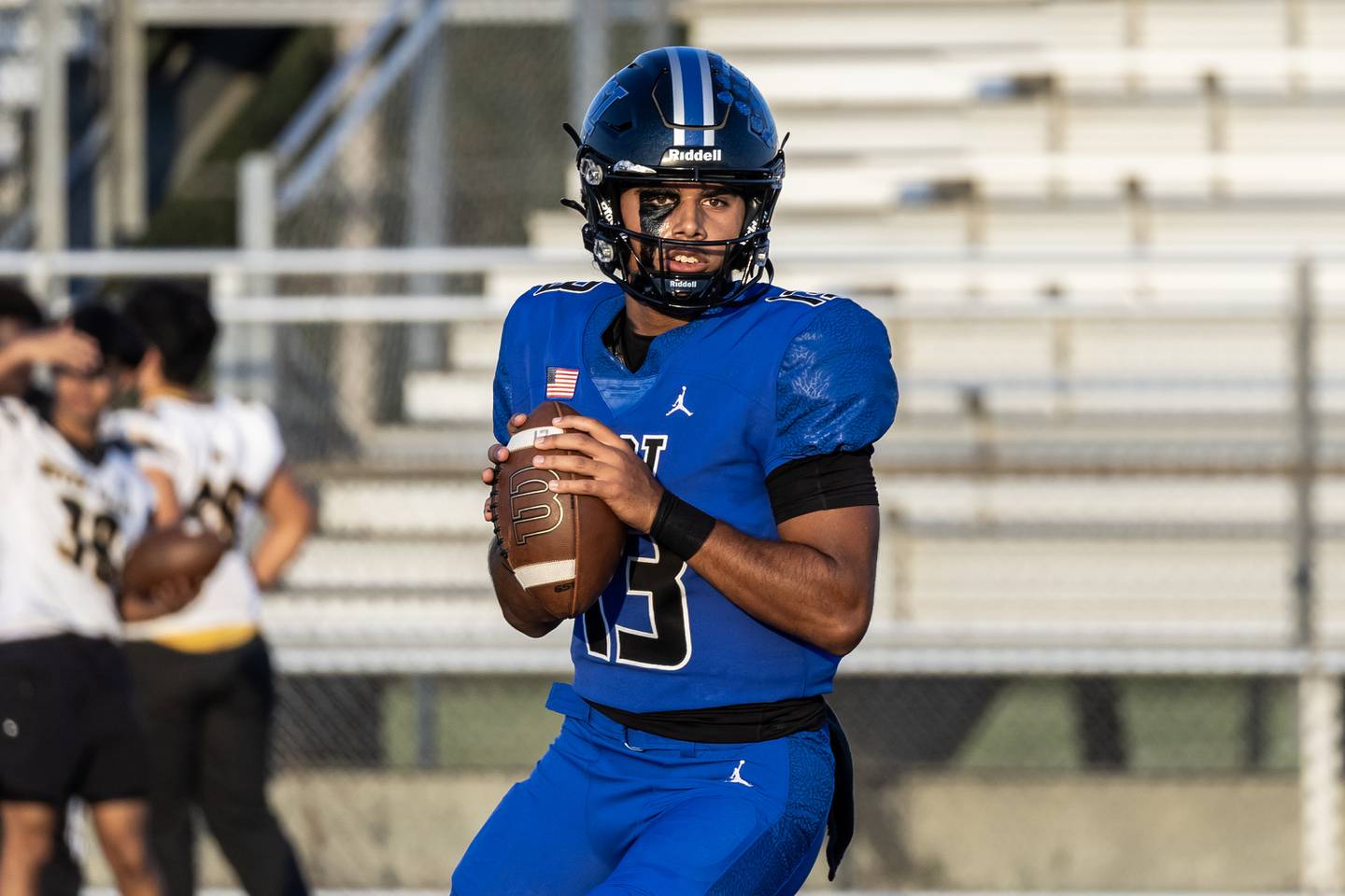 Lincoln-Way East's Jonas Williams warms up before the varsity football game against Metea Valley at Lincoln-Way East on Oct. 3, 2025. Williams went on to break the state passing touchdown record during the game.