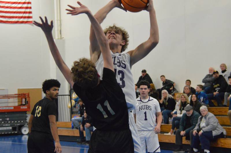 Rochelle's Braxton Bruns goes up strong for two of his nine points during the Hubs' sophomore basketball game with Sycamore.