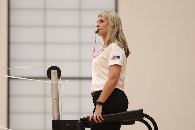 An IHSA referee watches the volley during the match between Lincoln-Way West and Plainfield East on Wednesday, March 22nd. 2023 in New Lenox.