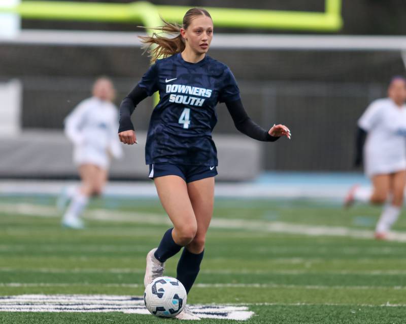Downers Grove South's Megan Pogorelec (4) advances the ball during soccer match between Riverside-Brookfield at Downers Grove South.  April 10, 2025.