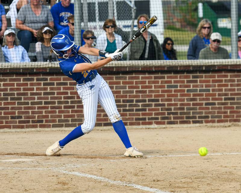 Wheaton North's Reagan Crosthwaite (21) gets a base hit during the sectional semifinal game while taking on Weaton Warrenville South held at Oswego High School.