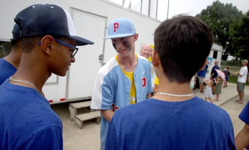 Carter Dees of the Lake in the Hills Phenom team greets players from Team Brazil during MCYSA 2023 Summer International Championships Opening Ceremonies Friday June, 14, 2023 at the Mickey Sund Complex in Lippold Park in Crystal Lake.
