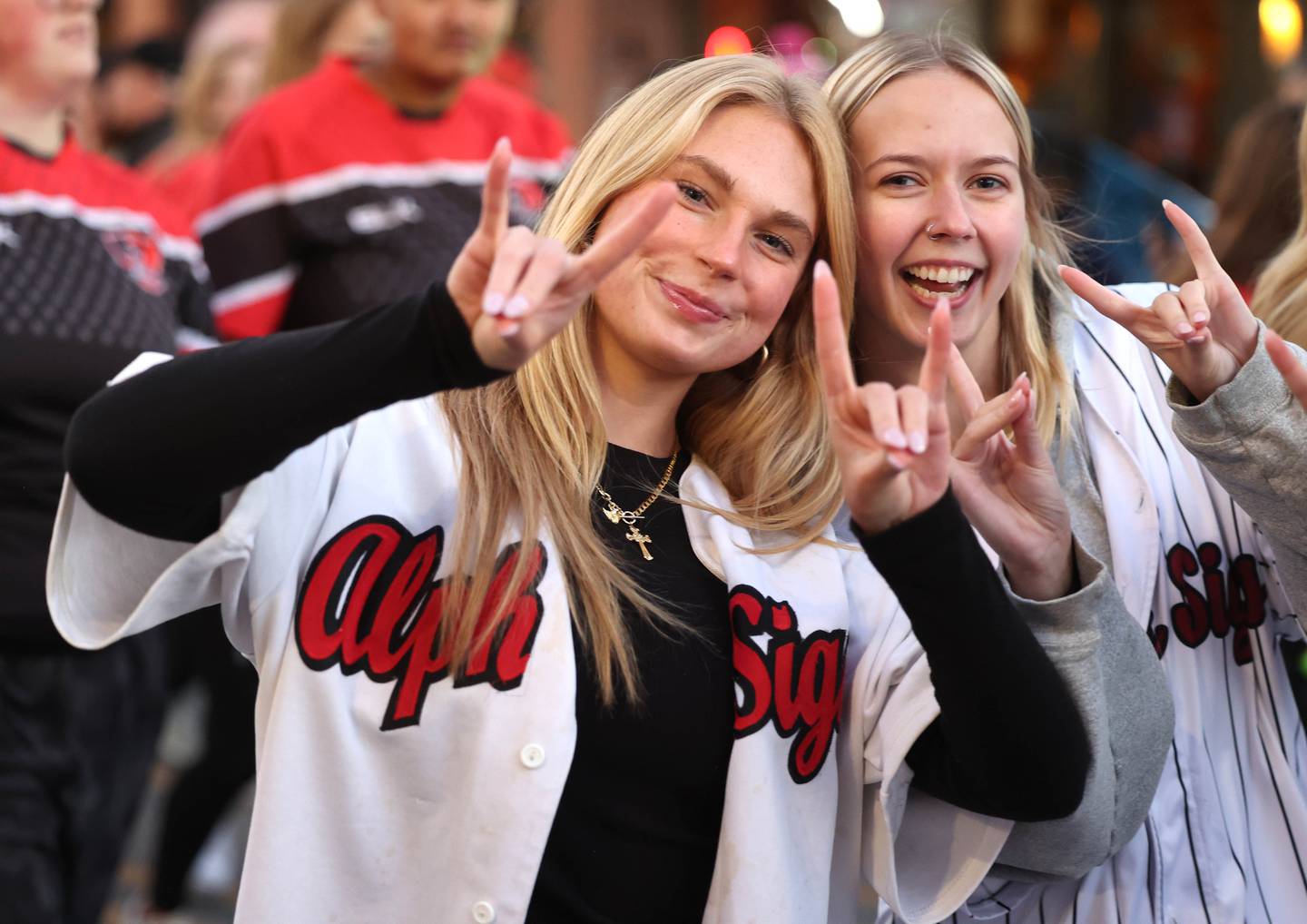 Northern Illinois University students have some fun Thursday, Oct. 17, 2024, in downtown DeKalb during the Huskie Homecoming Block Party.