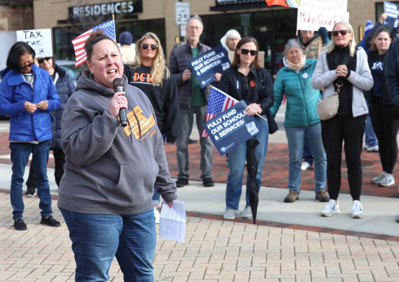 Dina Sweet, co-president of the DeKalb Classroom Teachers Association, speaks Friday, May 1, 2026, during a May Day rally at Memorial Park in downtown DeKalb. The group gathered to advocate for workers’ rights and push for billionaires to be taxed amid cost-of-living burdens they argue are hurting everyday Americans.