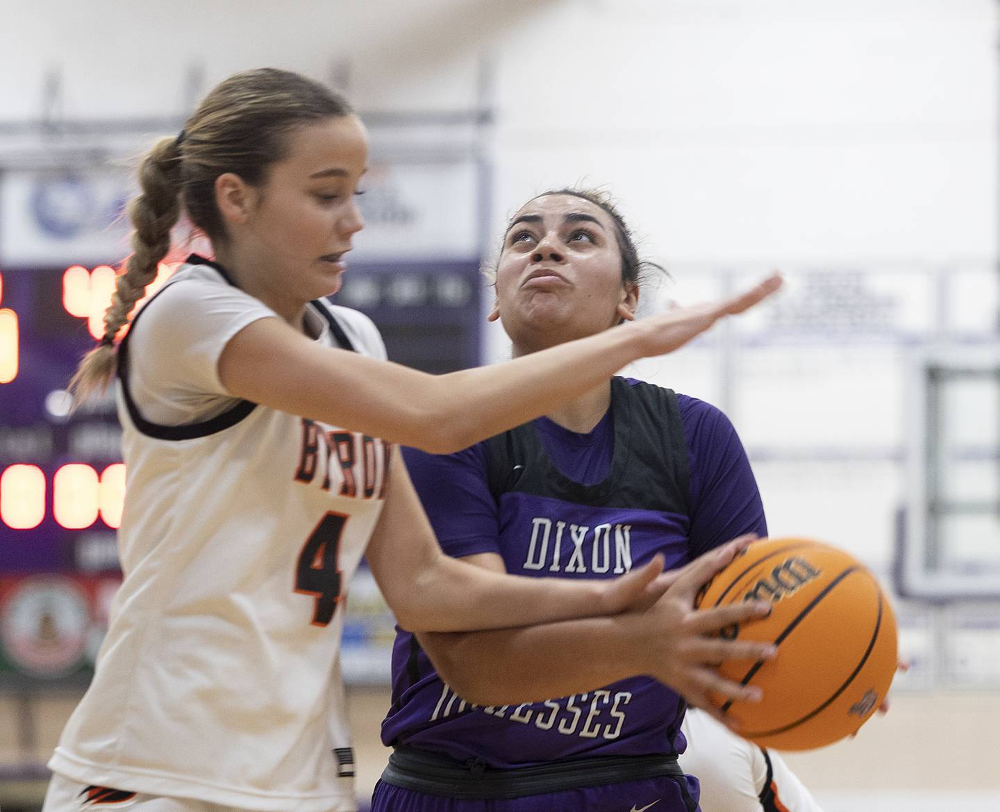 Dixon's Hallie Williamson is fouled by Byron’s Macy Groharin Friday, Dec. 27, 2024, during the Dixon Girls KSB Holiday Basketball Classic.