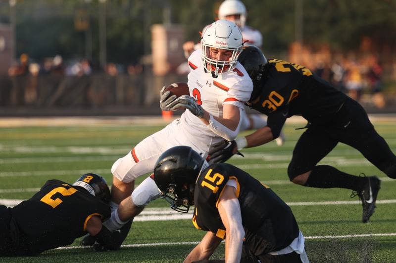 Shepard’s Anthony Loughran pushes for extra yards on a run against Joliet West on Friday, Aug. 25, 2023 in Joliet.
