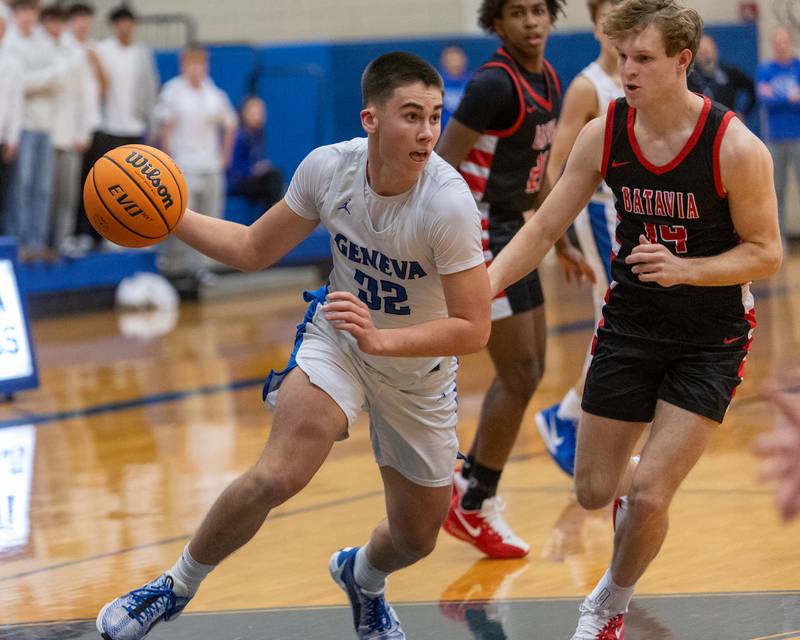 Geneva's Ben Peterson drives the baseline against Batavia's Brett Berggren on Friday, Dec.19,2025 in Geneva.