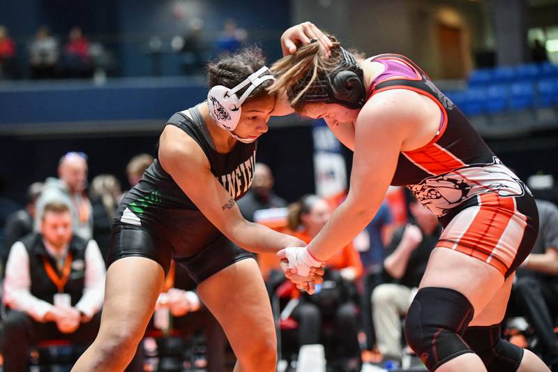 Alicia Tucker of Plainfield Central, left, wrestles in the 170-pound championship match in the IHSA Girls Individual State Finals on Saturday, March 1. Tucker claimed first place over August Rottmann of Highland.
