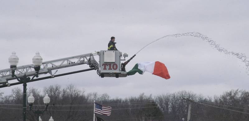 The Dixon Fire Company tests the water trajectory prior to the start of Dixon's St. Patricks Day parade Saturday, March 15, 2025. The parade wound through Dixon's downtown.
