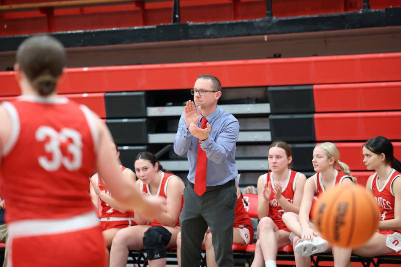 Ottawa head coach Brent Moore applauds a scoring play during Ottawa's 55-44 victory over  Bradley-Bourbonnais on Monday, Feb. 9, 2026.