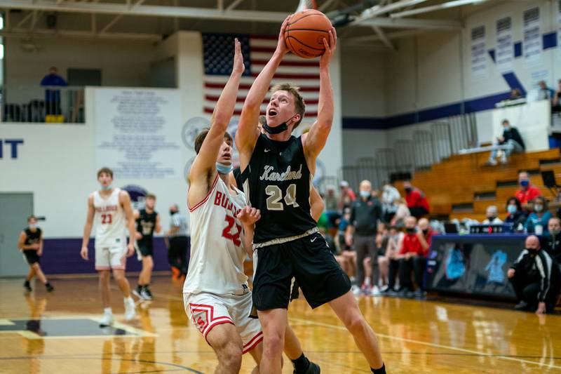 Kaneland’s Jacob Harrison (24) shoots the ball in the post against Streator's Christian Benning (22) during the Plano Christmas Classic at Plano High School on Monday, Dec 27, 2021.